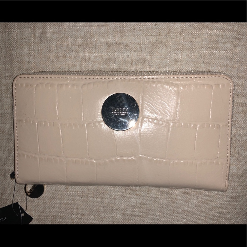 New DKNY nude leather zip around wallet.
